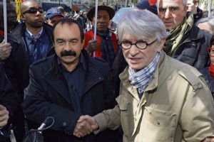 French Force Ouvriere (FO) labour union General Secretary Jean-Claude Mailly (R) and French CGT trade union general secretary Philippe Martinez (L) shake hands as they attend the tradional May Day march in Paris, France May 1, 2016. REUTERS/Philippe Wojazer