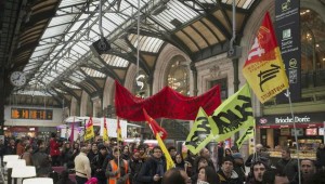 (FILES) In this file photo taken on April 26, 2016 protesters carry French workers' unions flags in the Gare de Lyon in Paris during a demonstration by railway workers of French state rail operator SNCF, as part of a strike to defend their work conditions. French rail unions will begin on April 2, 2018 a three-month rolling strike, two days out of every five, at state operator SNCF against planned reforms. / AFP / Elliott VERDIER *** Local Caption *** Grèves : la CGT lance ses troupes contre Macron Les cheminots ouvrent ce soir leur grève perlée prévue jusquà fin juin. En appelant aussi dautres bastions&finDL;à se mobiliser, le syndicat vise le président de la République et le gouvernement. La semaine sannonce très musclée sur le plan social, notamment mardi, avec le début de la grève des cheminots.