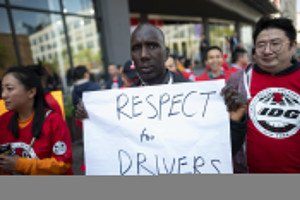 Members of the Independent Drivers Guild take part on the solidarity rally in support of drivers at the the Uber and Lyft New York City Headquaters on May 8, 2019 in New York City.